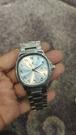 Universal Point Silver Watch With Arabic Counts